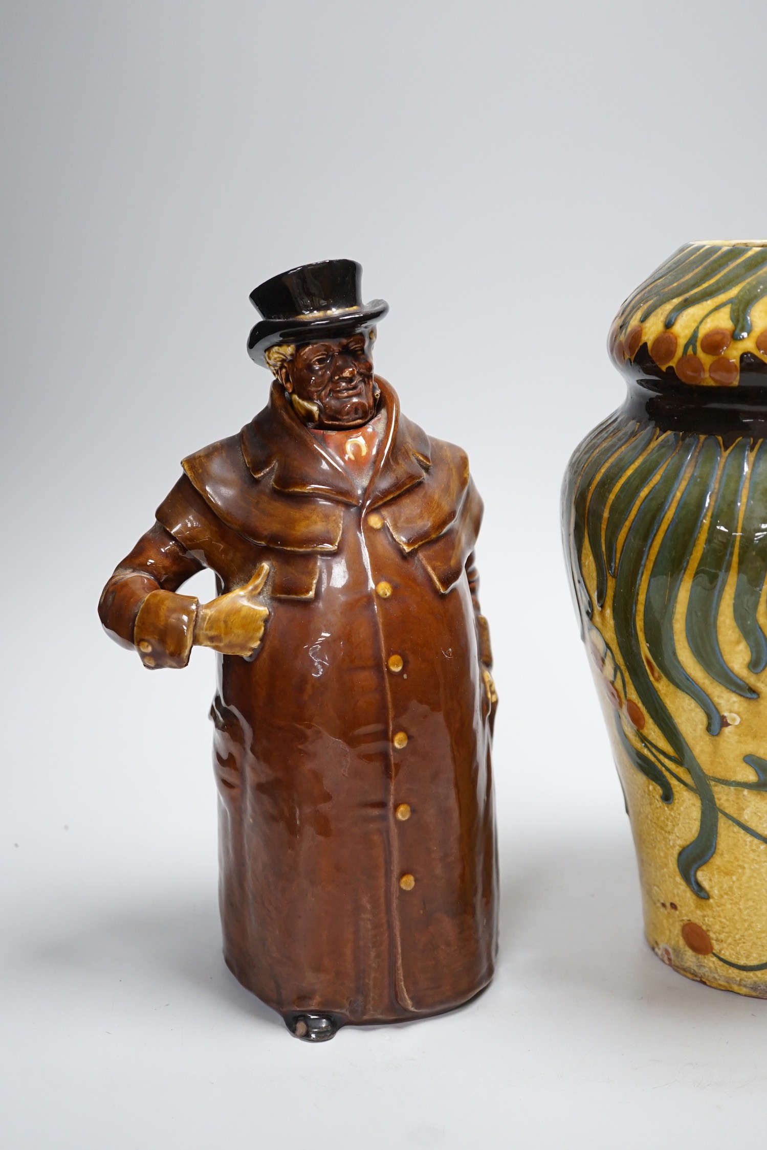 A Wileman & Co Faience vase and a Doulton Pickwick decanter, tallest 27cm